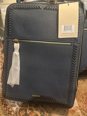 Calpak Kaya Navy Backpack with Gold Hardware and Tassel
